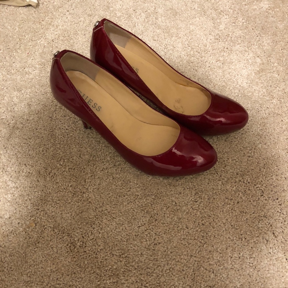 Red patent pumps
